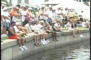 The crowd watches while the instructor shows them different kayaking techniques