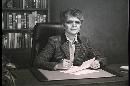 Picture-of-a-woman-at-her-desk-black-and-white