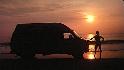 Picture-of-hightop-van-on-the-beach-at-sunrise