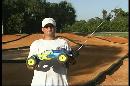 A picture of Kyle with his remote control gas powered race car.